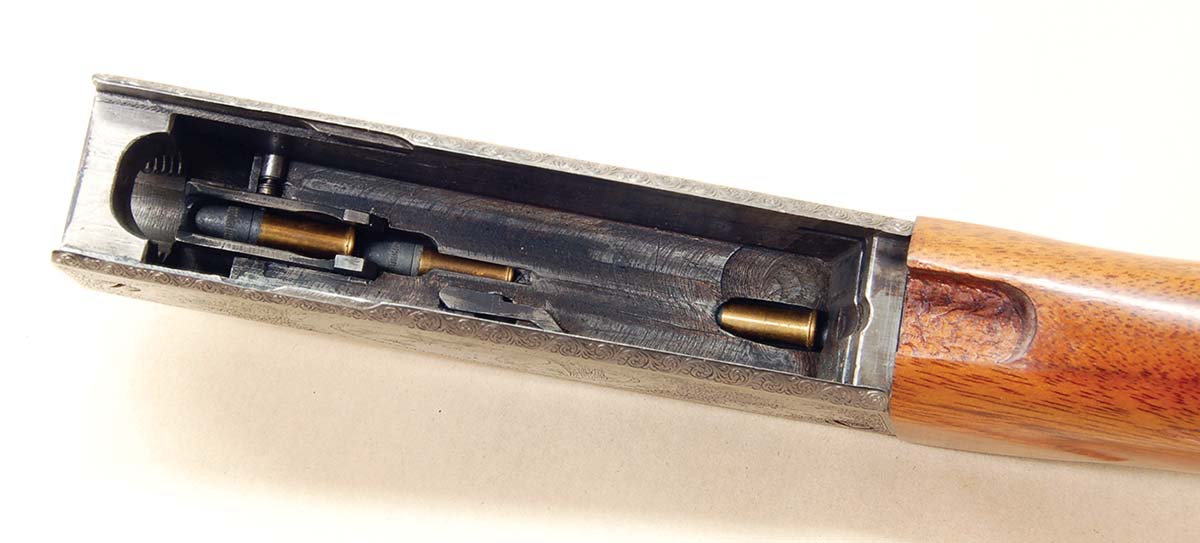 Cartridges feed through the precision-machined guide way in the receiver top. It must be kept clean, or cartridges will jam.
